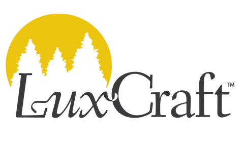 LuxCraft logo with yellow sun and trees on a white background